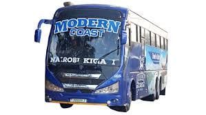 Red Modern Coach double-decker bus with side view showing branding and large windows against white background